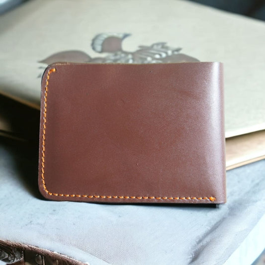 Indulge in rustic sophistication with our handmade leather wallet in a rich coffee brown hue. Meticulously crafted by skilled artisans, this wallet not only exudes warmth but also boasts a timeless appeal. The smooth, supple of the genuine leather enhances its durability, ensuring both style and functionality. Elevate your everyday essentials with this exquisite blend of craftsmanship and earthy elegance.