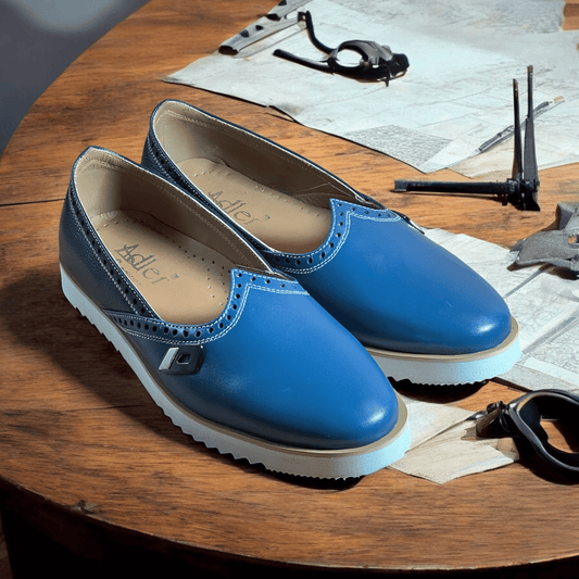 Step into comfort and style with our Azure Elegance Handmade Leather Moccasins. Crafted from the finest quality leather, each pair is meticulously designed by skilled artisans to ensure durability and elegance. The rich blue hue adds a unique touch, making them perfect for both casual outings and special occasions. Featuring a soft, cushioned insole and flexible outsole, these moccasins provide all-day comfort without sacrificing style. 