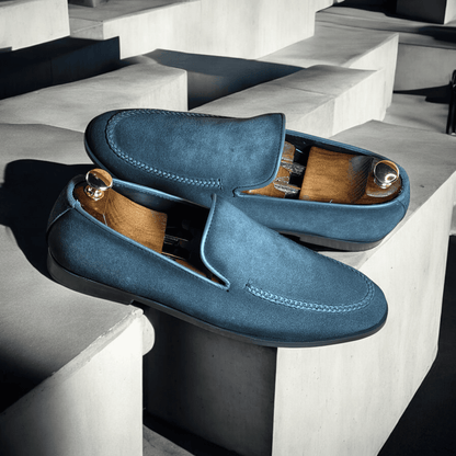 Introducing the Slate Luxe Suede Moccasins, where sophistication meets comfort. Crafted from premium grey suede, these handmade moccasins exude elegance with every step. The soft, supple leather molds to your feet, providing a perfect fit and unparalleled comfort. 