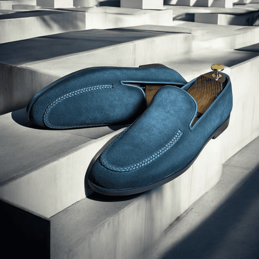 Introducing the Slate Luxe Suede Moccasins, where sophistication meets comfort. Crafted from premium grey suede, these handmade moccasins exude elegance with every step. The soft, supple leather molds to your feet, providing a perfect fit and unparalleled comfort. 
