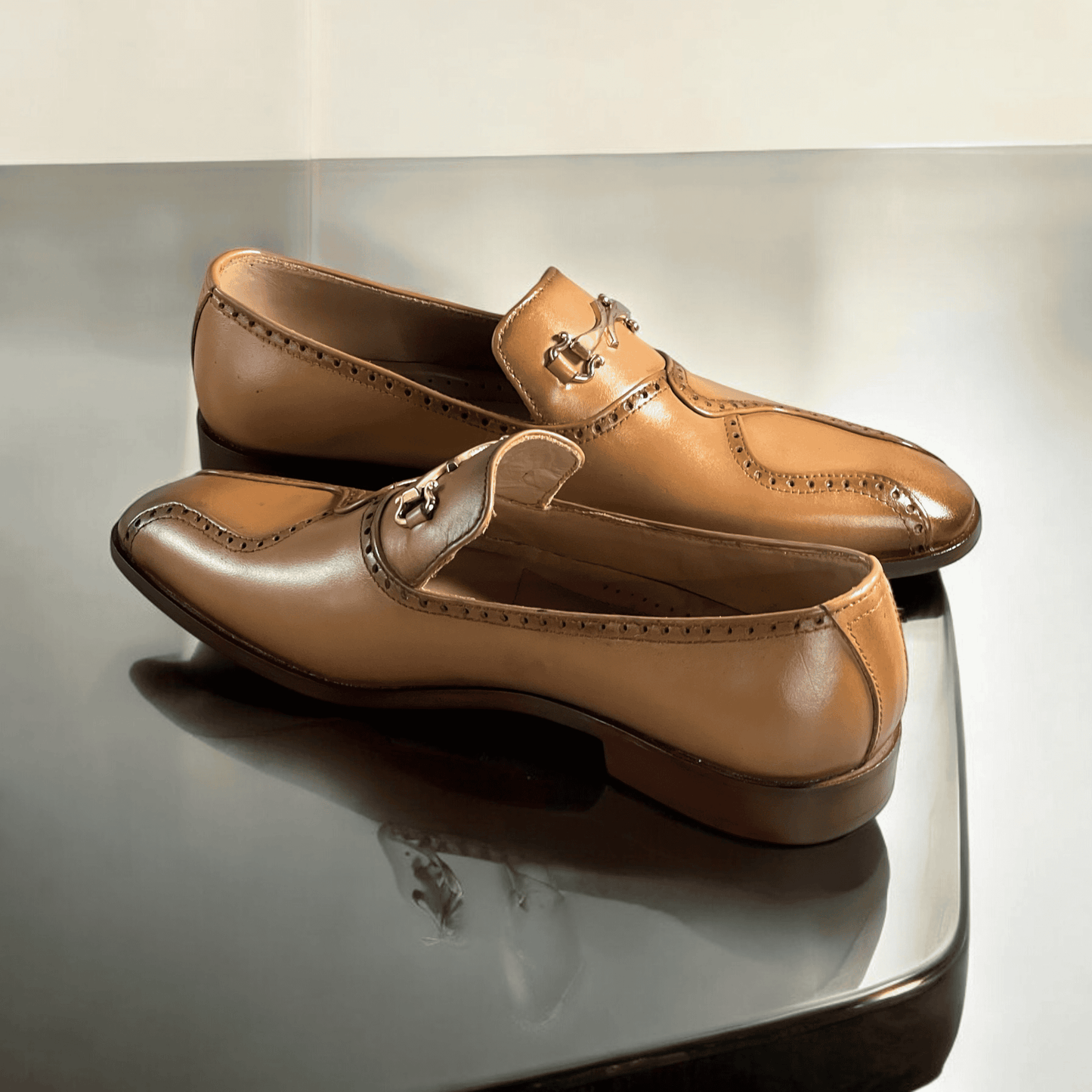 Designed for both comfort and style, the *Baymen* moccasins feature a soft leather lining, providing a smooth, breathable interior that molds to your foot for a personalized fit. The slip-on design offers convenience without sacrificing elegance, while the hand-stitched detailing adds a touch of refinement to every pair.